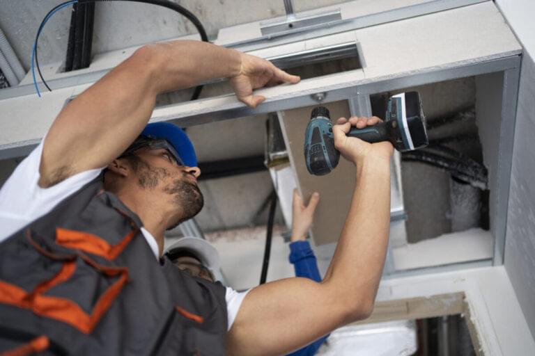 Garage door technician working on-site in Midland, TX
