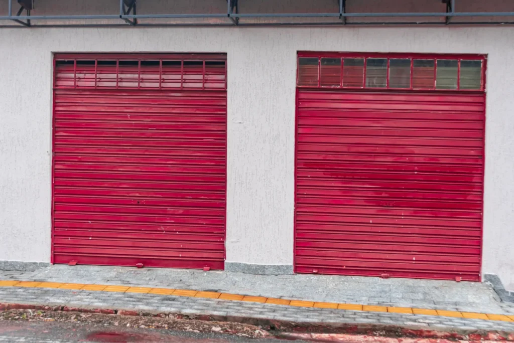 alt="Broken garage door cable close-up"